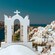 A cliff side village featuring classic Cycladic architecture